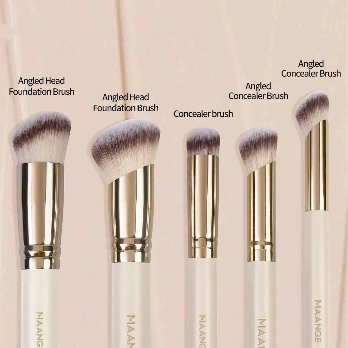 Five apricot-coloured angled makeup blush brushes with synthetic bristles arranged together