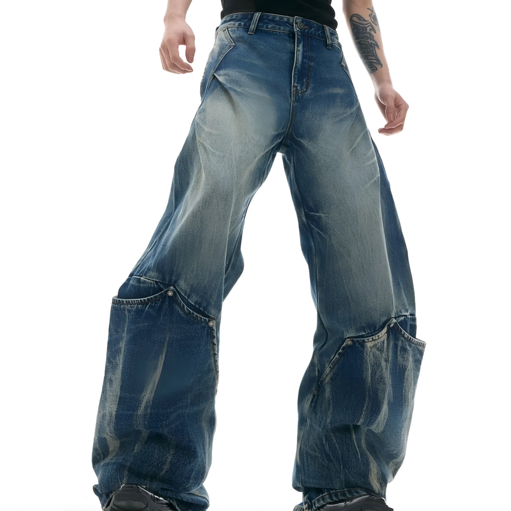 Men's verdant blue retro washed loose fit jeans with burst pattern and curved knife detail.
