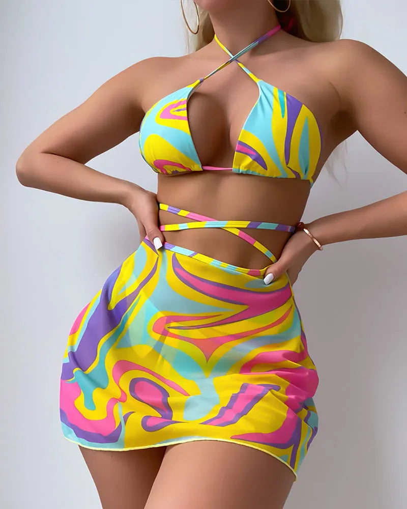 Yellow striped halter-neck swimsuit with lace-up front, includes matching skirt and shorts