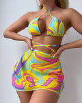 Yellow striped halter-neck swimsuit with lace-up front, includes matching skirt and shorts