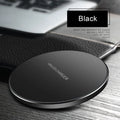 Ultra-thin black square wireless fast charger with USB cable on a table