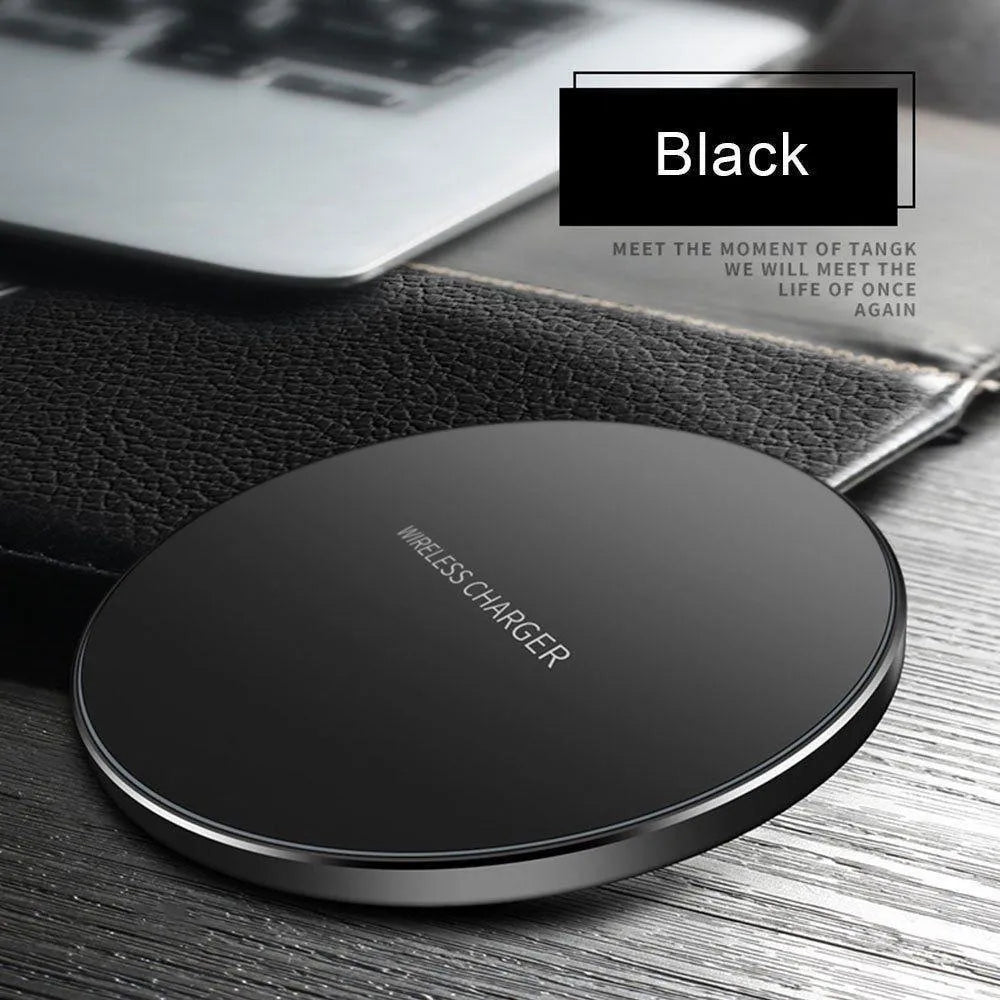 Ultra-thin black square wireless fast charger with USB cable on a table