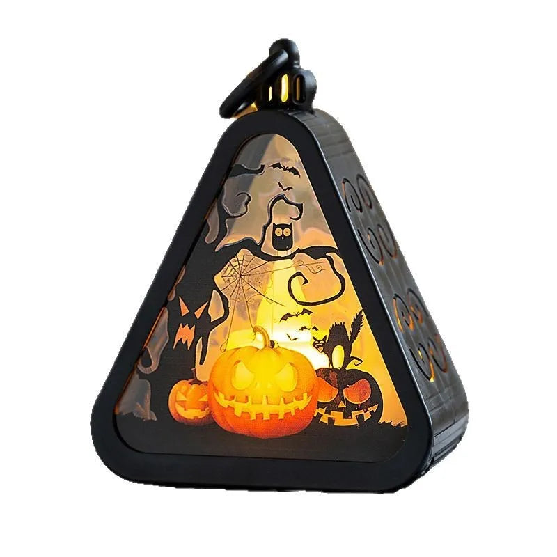 Halloween pumpkin lamp decoration with four theme options on tabletop