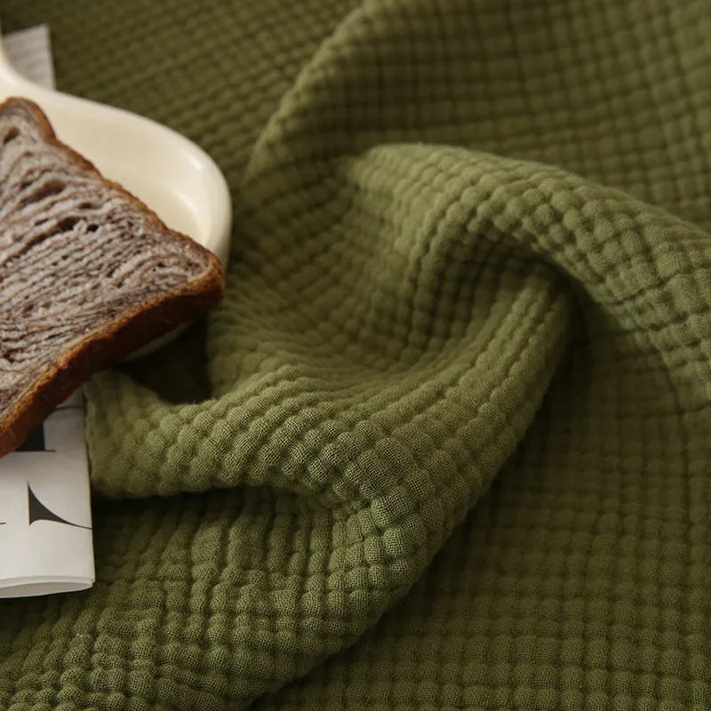 Four-layer gauze cotton blanket with tassel fringe in avocado green colour
