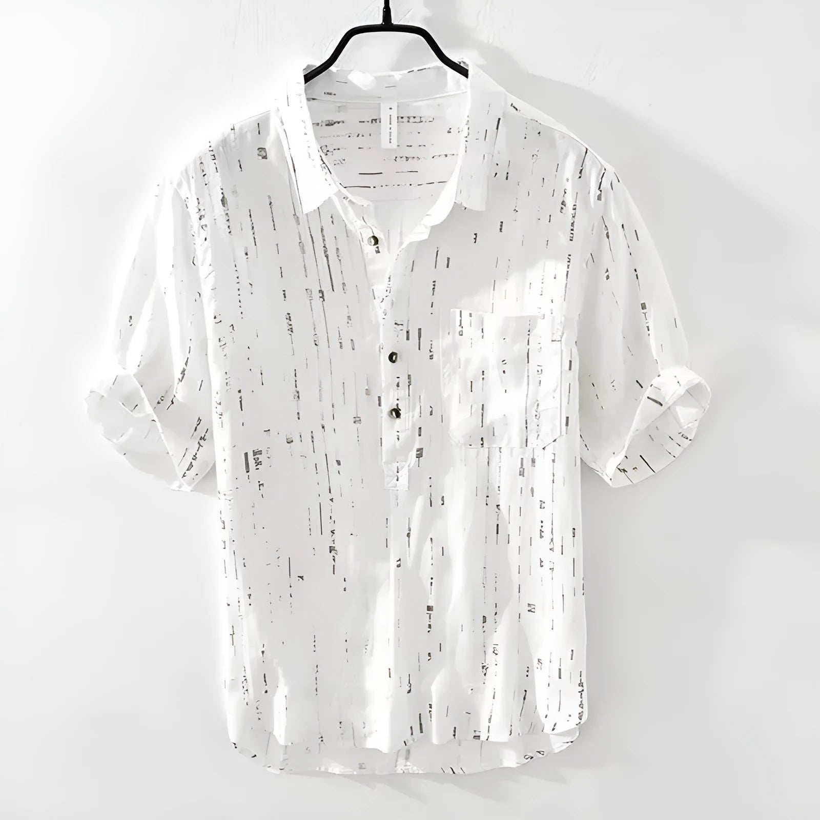 Men's loose-fit short-sleeve polo shirt cardigan in black, laid flat.