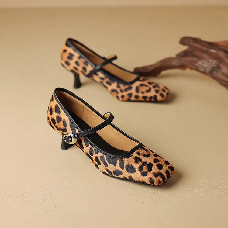 Women's black square toe stiletto heel ankle-strap shoes with a horse hair upper.