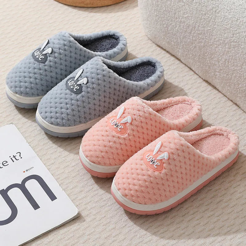 Women's plush rabbit plaid house slippers with thick rubber non-slip soles in apricot colour.