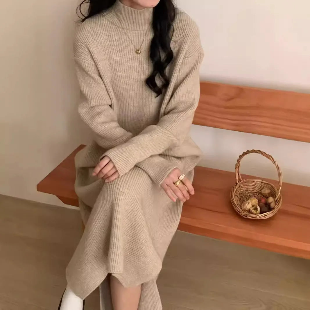 Half turtleneck knitted acrylic dress in graphite colour with overknee length and long sleeves.
