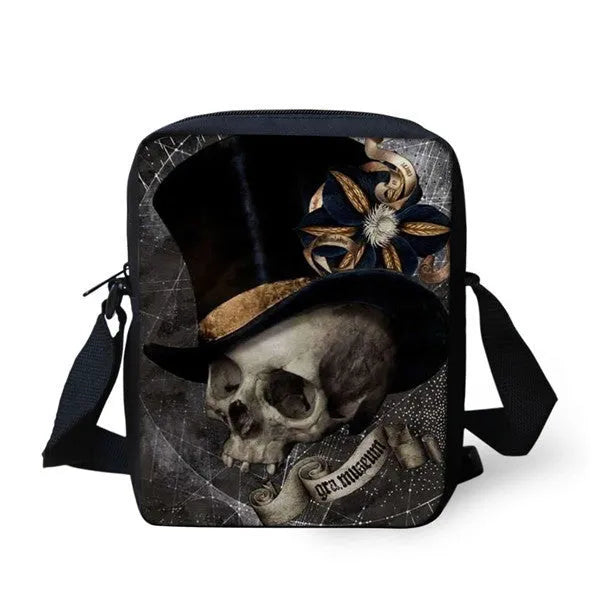 A medium-sized black children's messenger bag with a skull print, showing double shoulder straps and a zipper opening.
