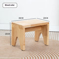 Distressed solid wood changing stool with bracket structure in a rustic finish.