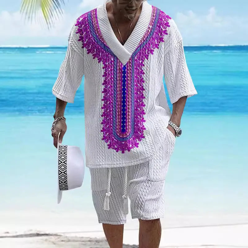 Man wearing a printed drop-shoulder knitted short-sleeve top with matching shorts in a casual setting.