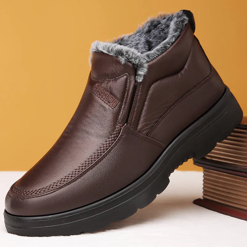 Men's black winter slip-on shoes with fleece lining and a textured non-slip rubber sole.