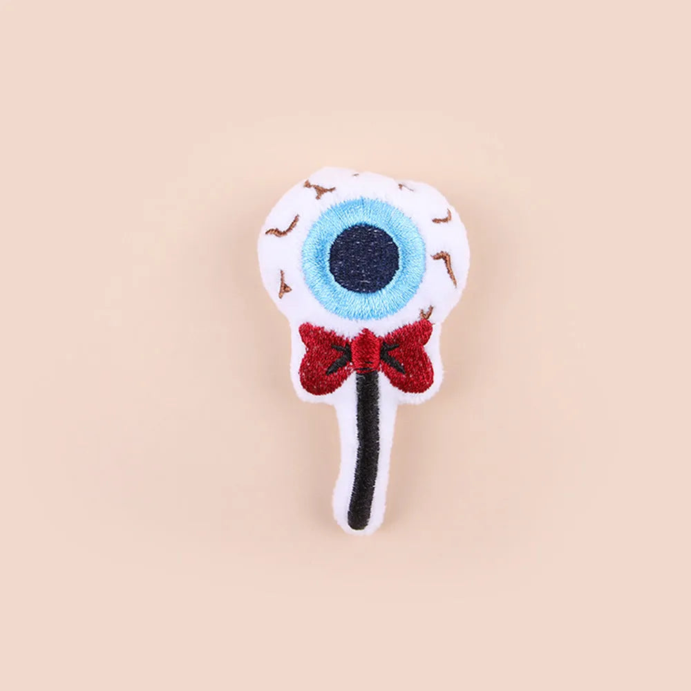 Plush cat teaser wand with colourful pom-pom attachment in candy pink design