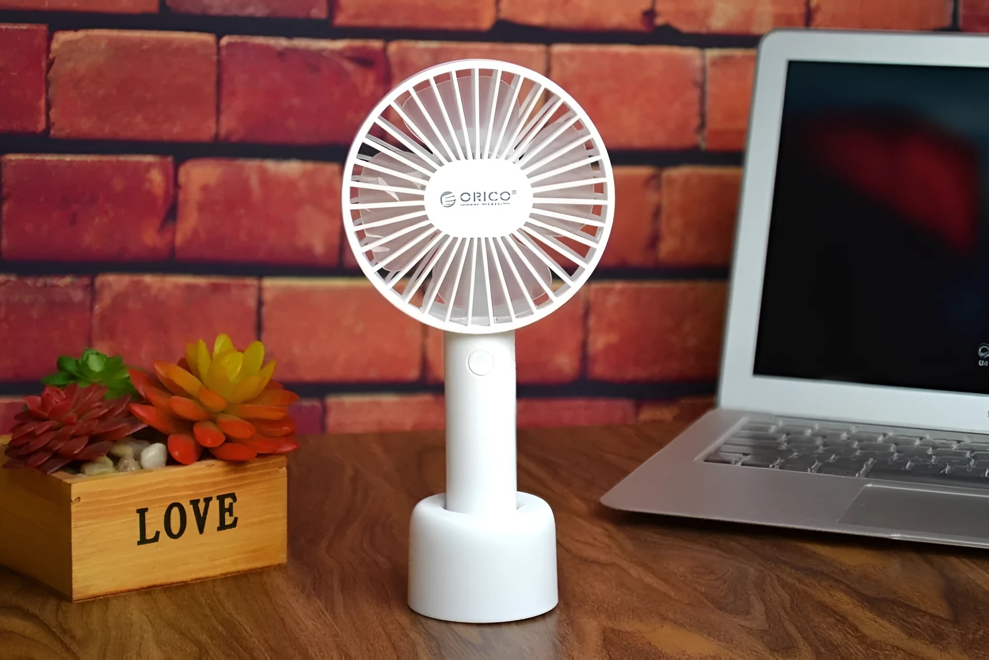 White ORICO FH1 USB rechargeable portable fan with fine line details on desktop