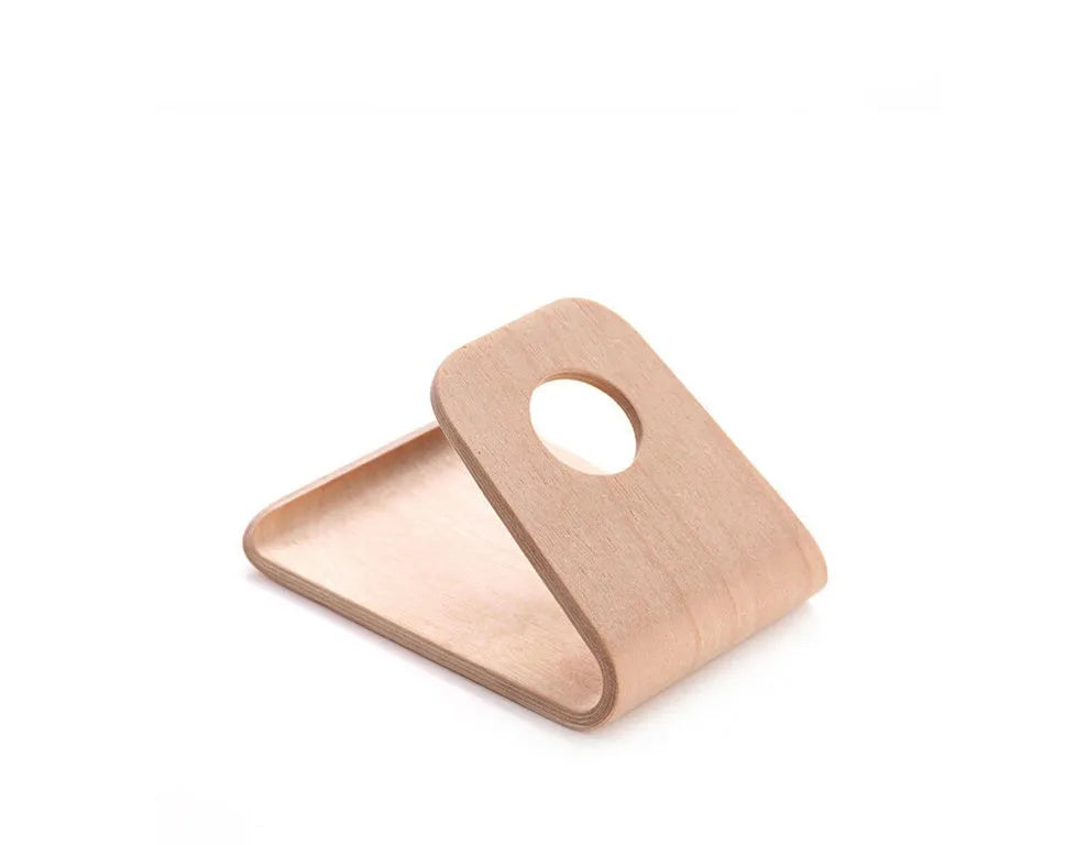 Wooden phone stand in walnut brown and white maple holding an iPhone upright on a desk.