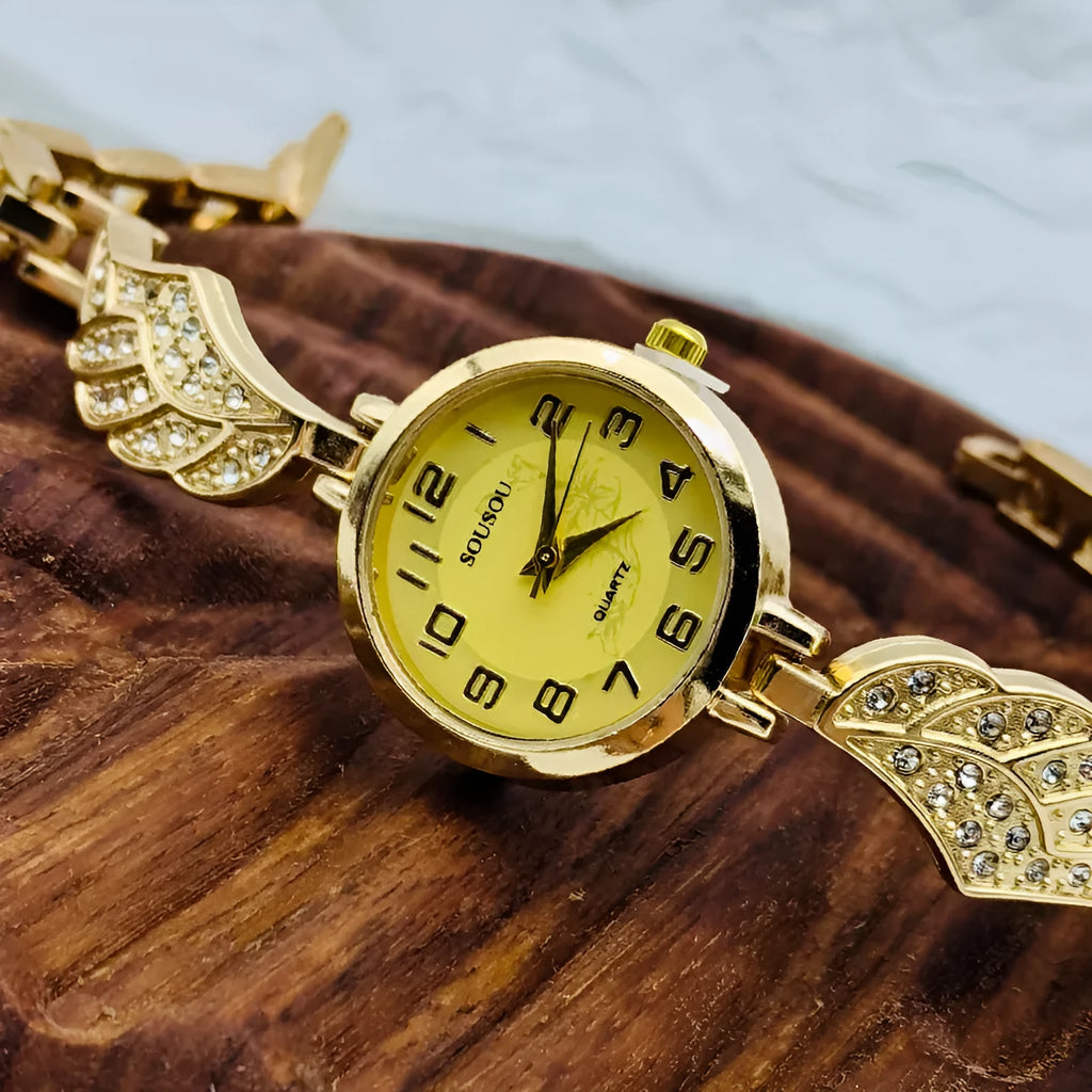 Stainless steel women's watch with round dial showing gold surface option and vachette clasp