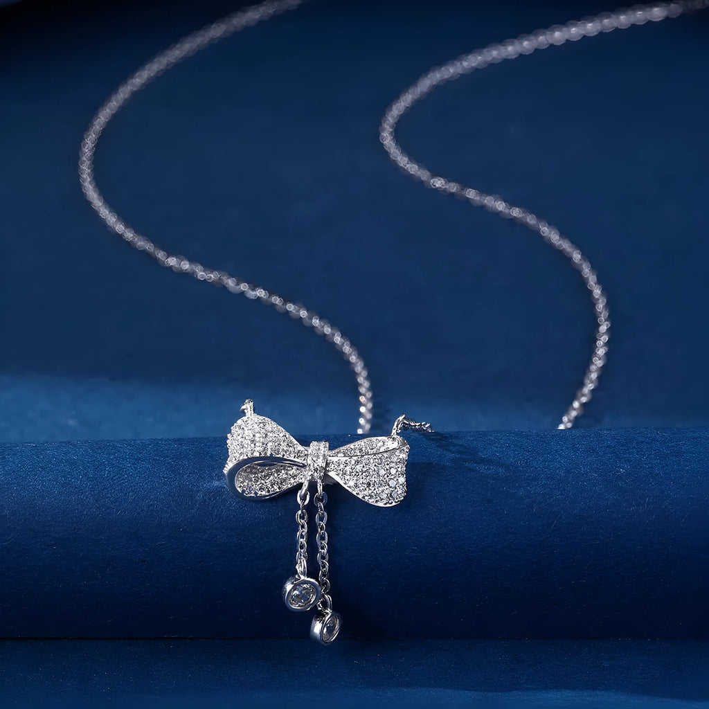 S925 sterling silver bow pendant necklace on adjustable O-ring chain, clavicle length