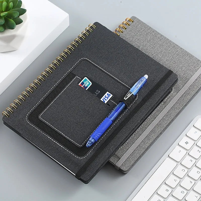 Erasable coil notebook with forest rock stone paper cover in black woven or wood grain design with pen