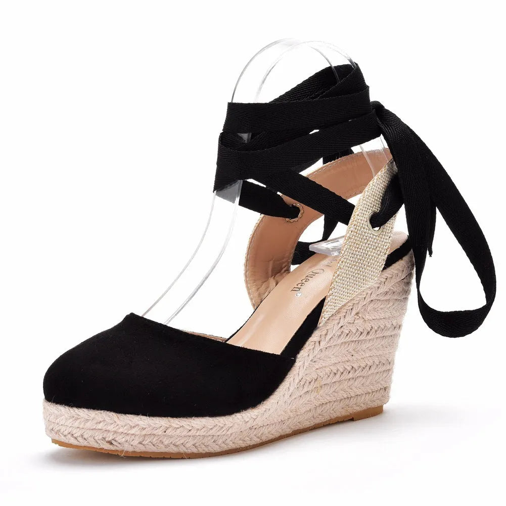 Women's apricot wedge sandals with buckle strap, beaded detail, and a round toe.