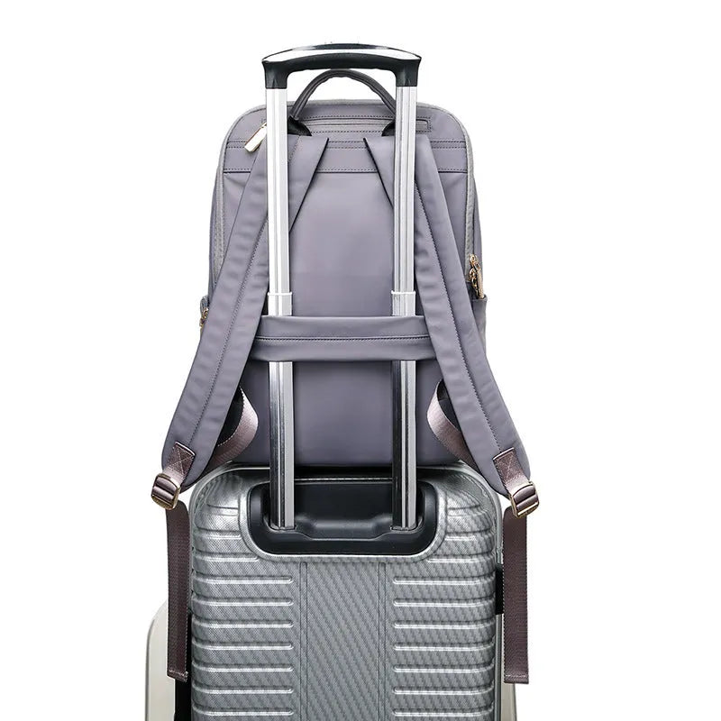 Black Oxford cloth women's large capacity backpack with anti-theft features.