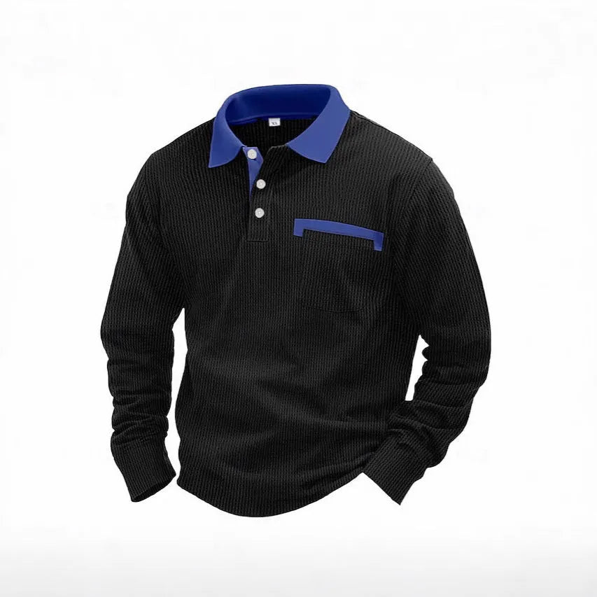 Man wearing a long-sleeved dark green waffle knit polo shirt with a loose fit and a collar.
