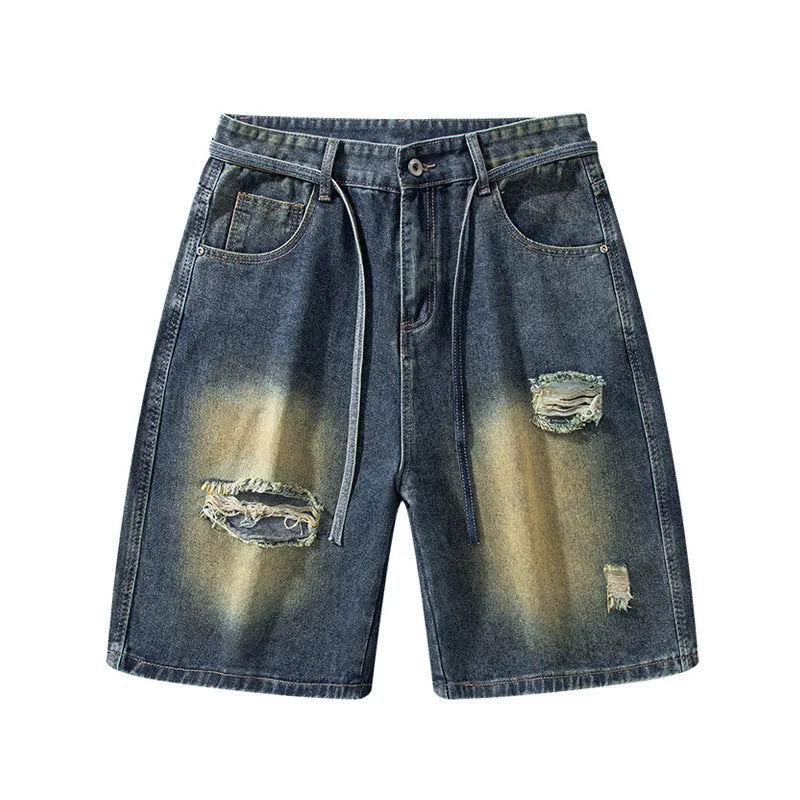 Men's loose fit ripped jeans in retro blue denim with distressed detailing and street style design