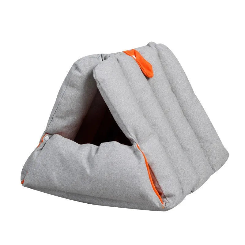 Blue triangular fabric cat nest with visible holes for connection, shown with removable cotton cover.
