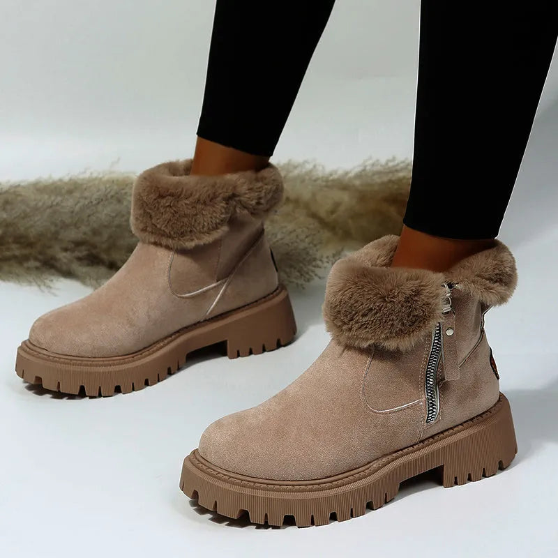 Women's black high-top faux suede snow boot with side zipper and non-slip sole.