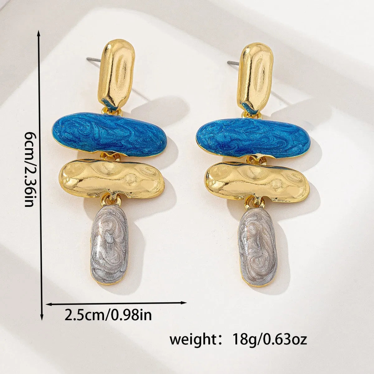 A pair of geometric stud earrings with a multicolour electroplated finish on a zinc alloy base.