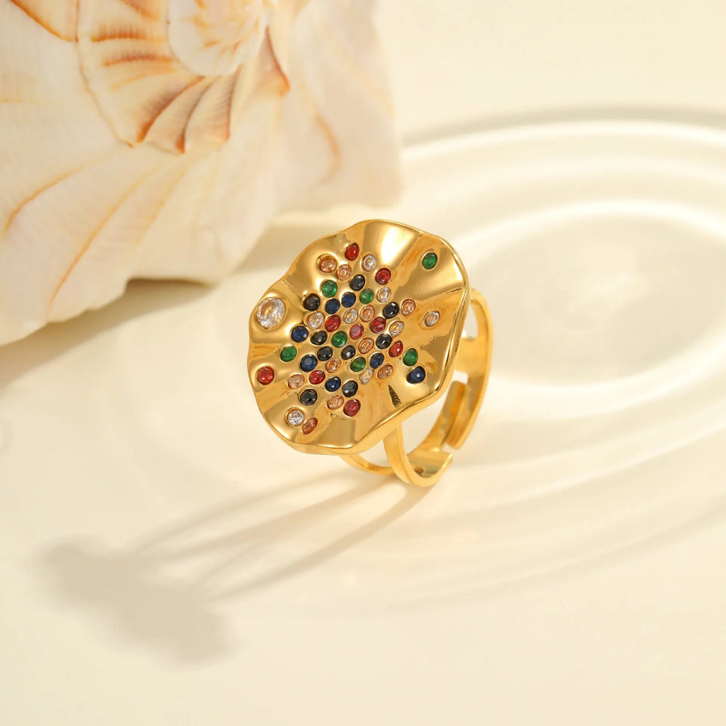 Adjustable open-mouth stainless steel ring with pleated geometric pattern and inlaid coloured crystal accents.