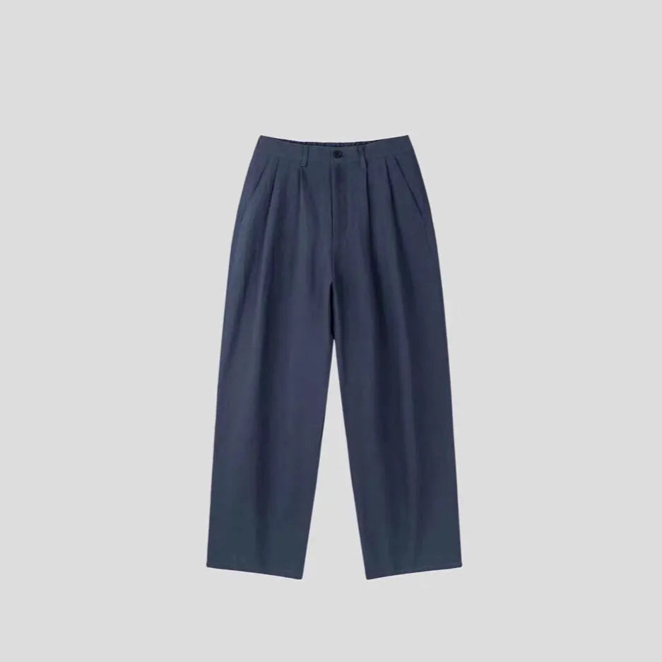Men's apricot-coloured wide-leg cotton linen blend trousers with a mid waist and pencil pant cut.