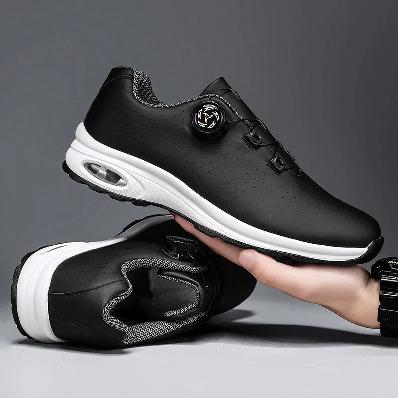 Low top tennis shoes in black with mesh upper, cross shoulder straps, and composite sole