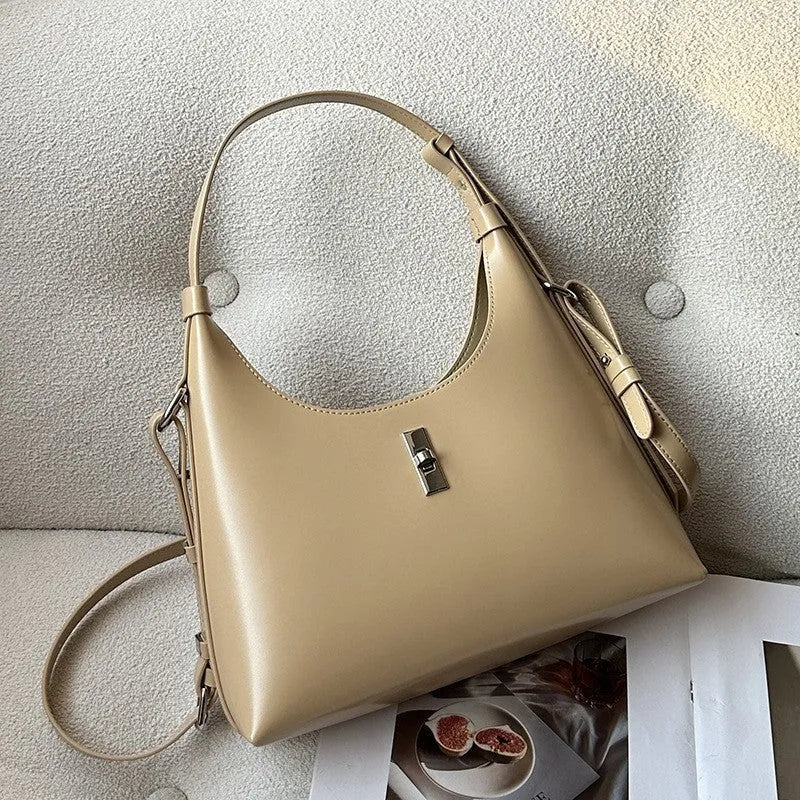 Genuine leather dumpling-shaped crossbody bag with shoulder strap and multiple pockets
