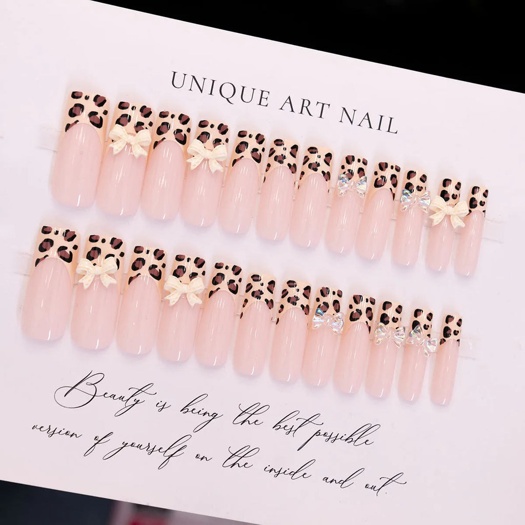 Leopard print false nail art kit with plastic butterfly decorations in colour WM296.