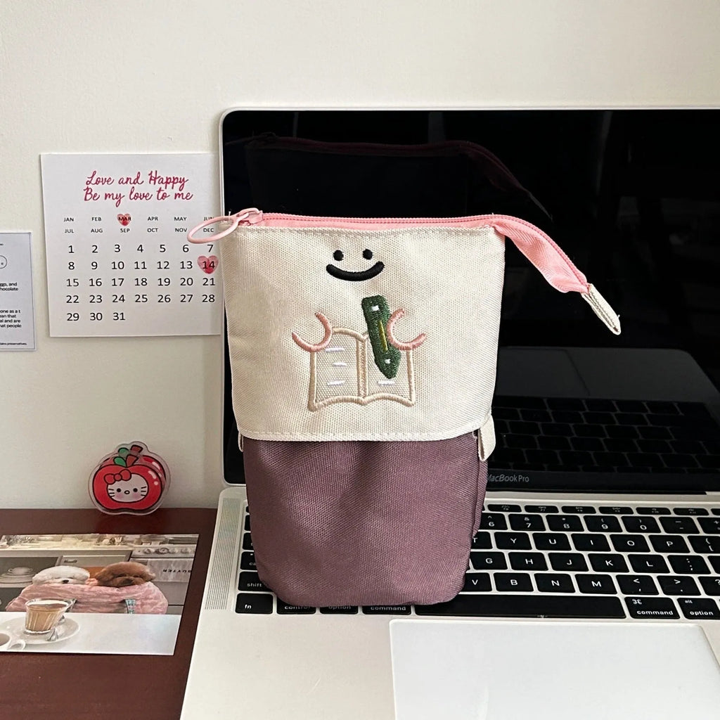 Brown Korean style cartoon pattern collapsible pencil case with zip closure showing 17cm by 14cm dimensions