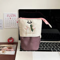 Brown Korean style cartoon pattern collapsible pencil case with zip closure showing 17cm by 14cm dimensions