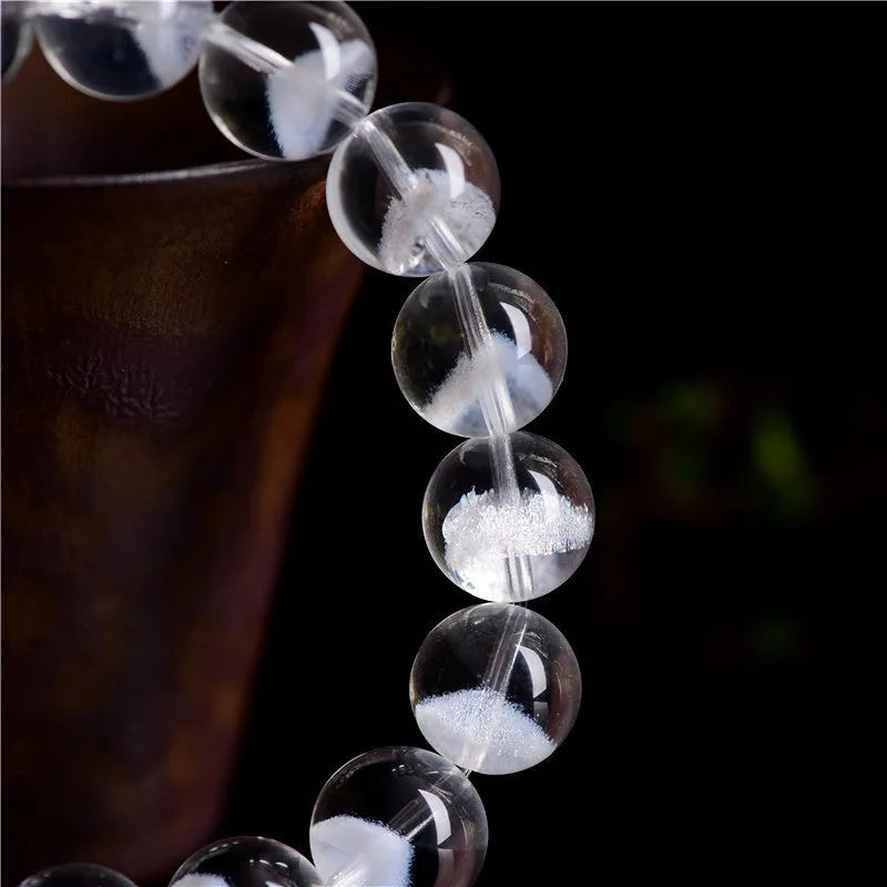 Women's white crystal ghost pyramid bracelet with Ruyi charm in graduated sizes