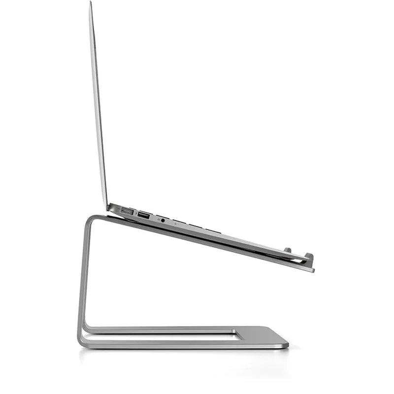 Black aluminium alloy laptop stand with ventilation slots on desktop
