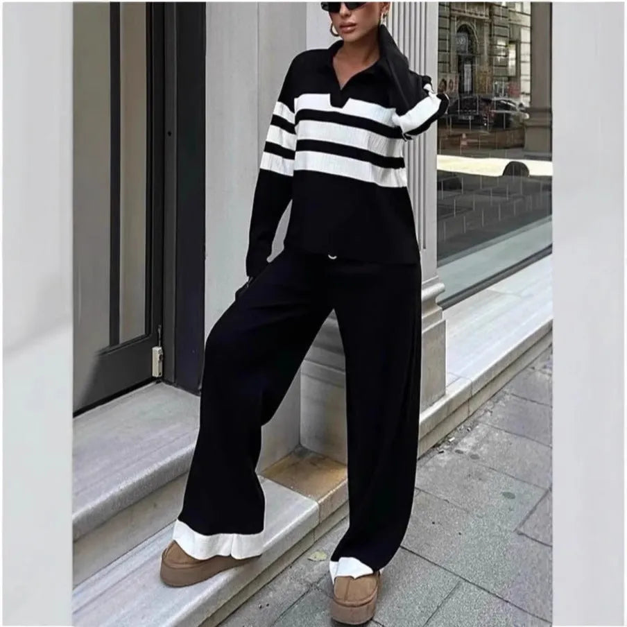 Women's black and white striped knitted two-piece set with polo collar top and matching trousers