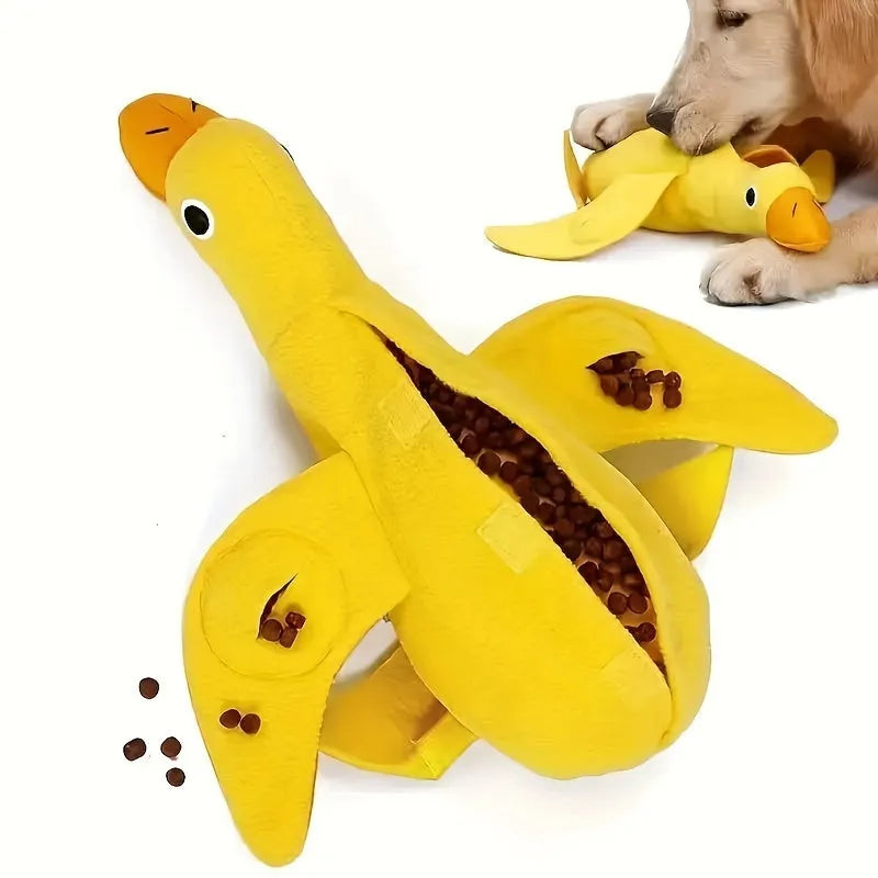 Yellow plush duck dog training toy with squeaker and treat dispensing features