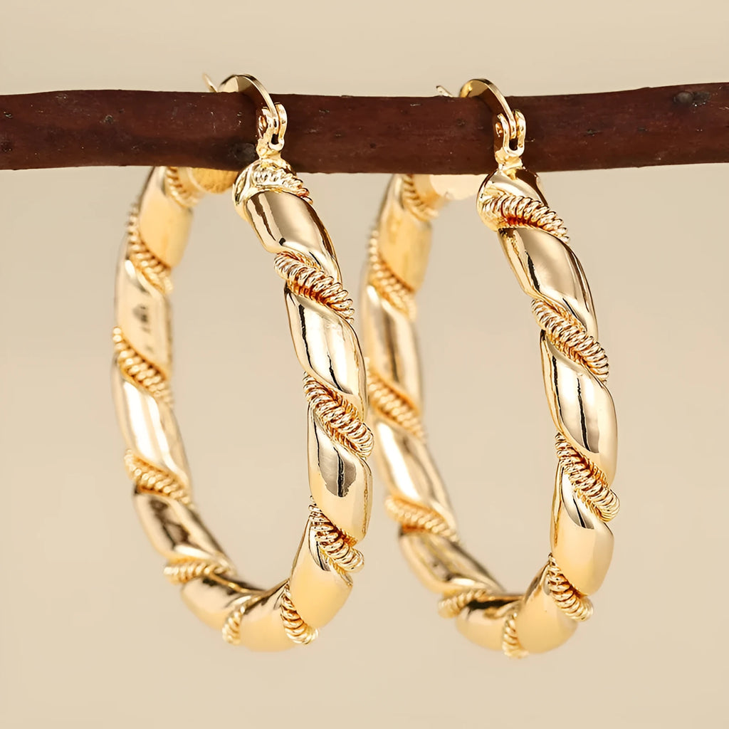 Women's geometric copper ear clips with ring and line elements in golden colour