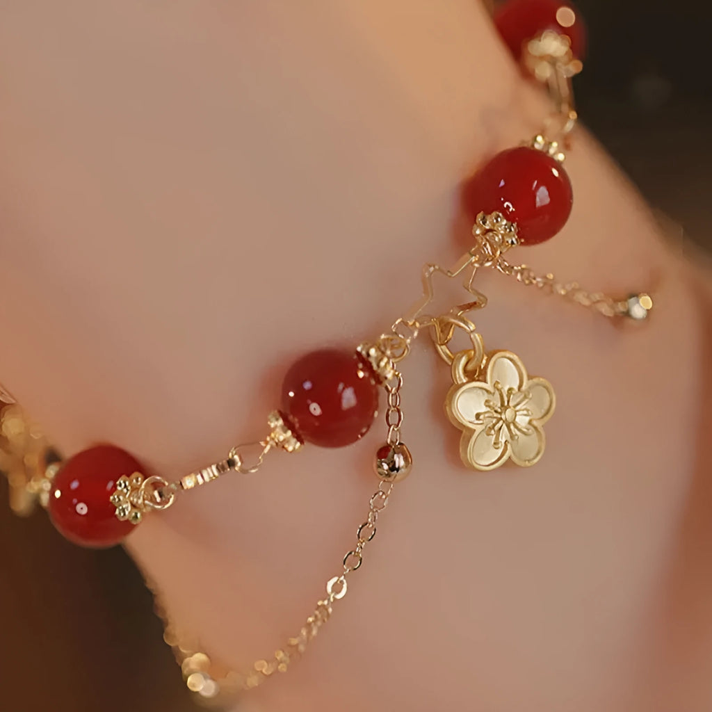 Red agate double layer bracelet for women with floral and peach blossom decorative elements.