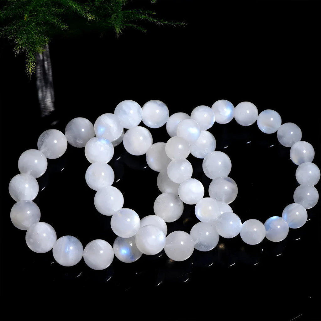 Natural blue moonlight moonstone round bead bracelet on wrist showing geometric arrangement
