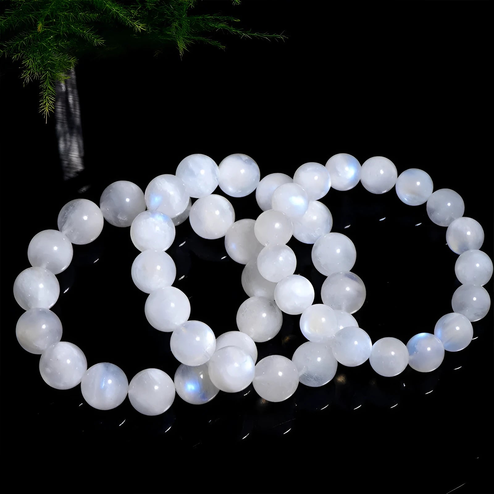 Natural blue moonlight moonstone round bead bracelet on wrist showing geometric arrangement