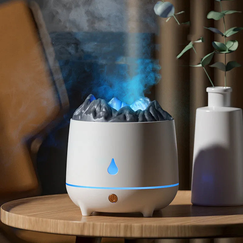 White volcanic-shaped ultrasonic humidifier and essential oil diffuser with USB cable on a wooden table.