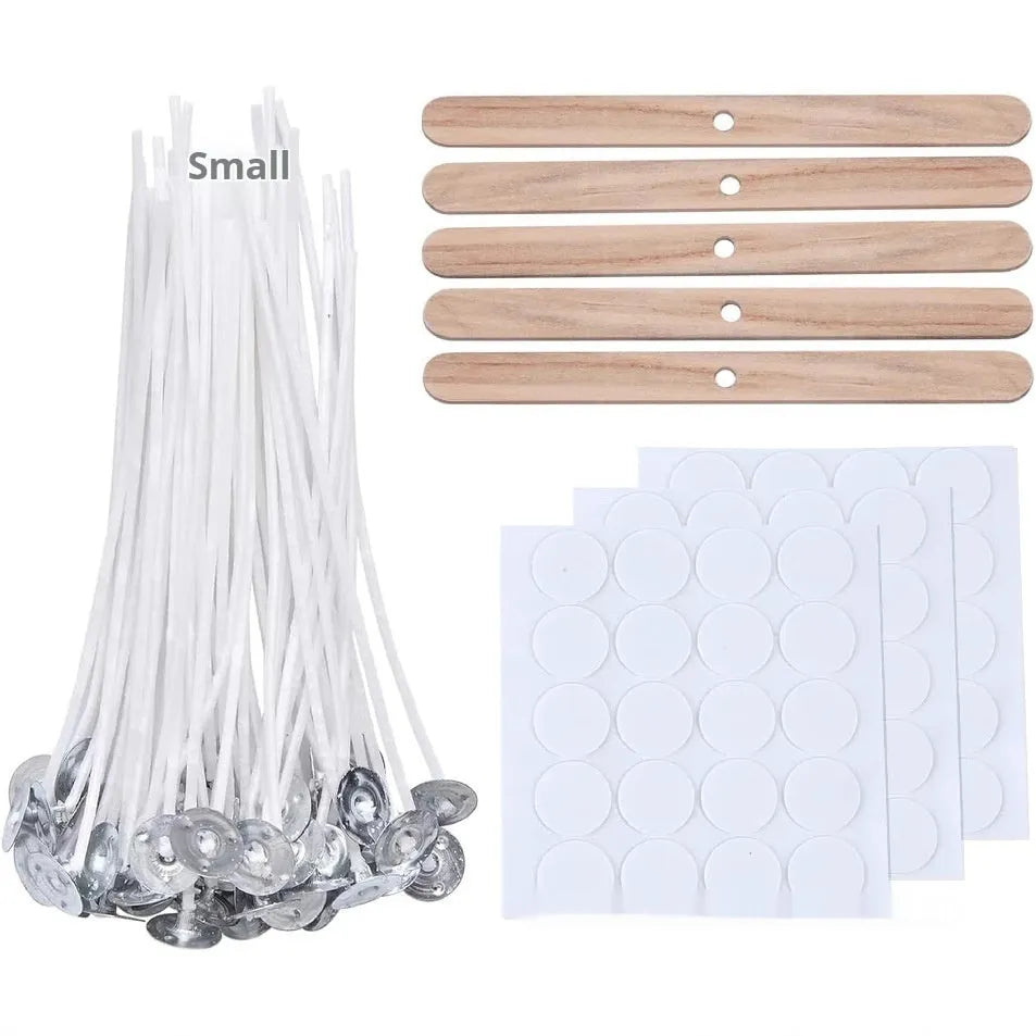 White cotton candle wicks in three lengths: 2.6cm, 6cm, and 8cm, laid out on a surface.