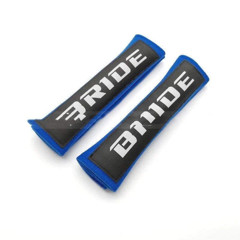 Cotton sponge cloth car seat belt shoulder pads in black, blue, and red colours, showing embroidered weaving detail.