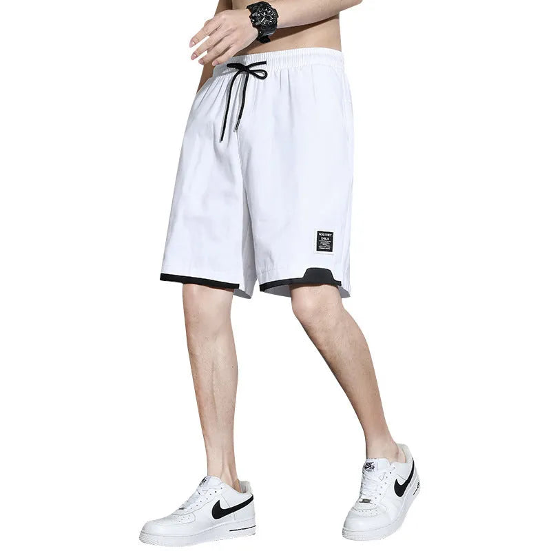 Cotton shorts for boys in black, khaki, or white, showing mid-waist and shorts-length design.