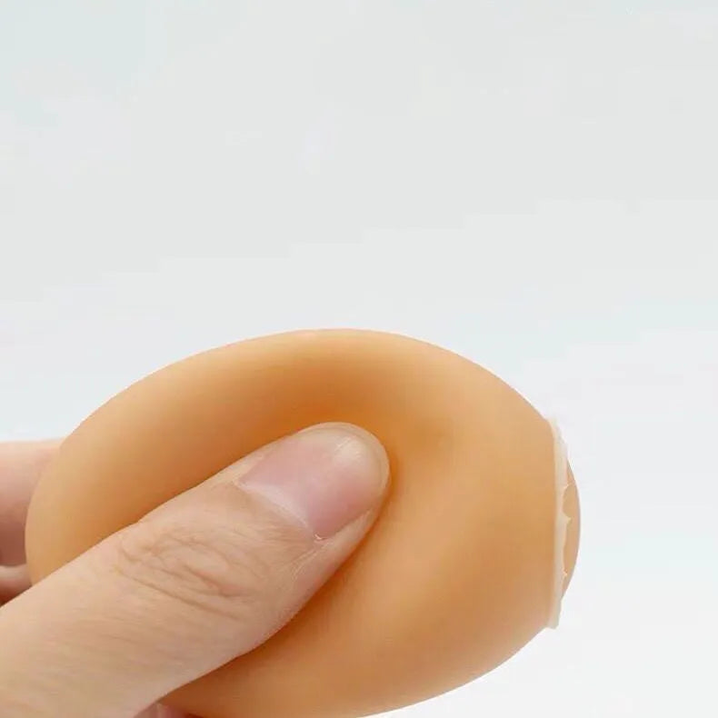 Egg-shaped dog chew toy with textured surfaces for dental cleaning and sound feature