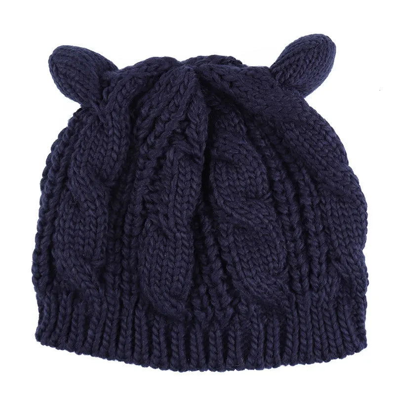 Hand made 3D cat ear knitted wool beanie in winter colours on head model